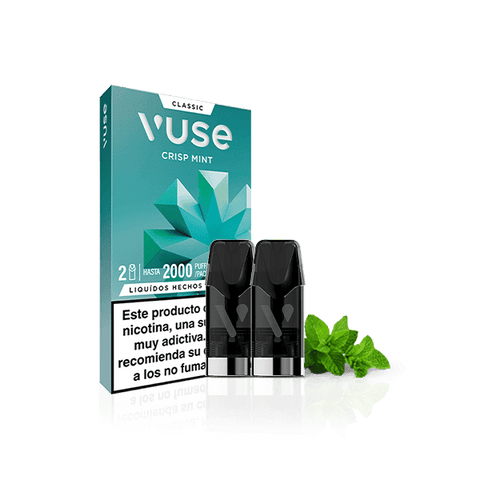 Una caja de Vuse Pods - Menta de Vuse se muestra con dos vainas negras, hojas de menta fresca y una etiqueta de advertencia de nicotina española sobre un fondo blanco.